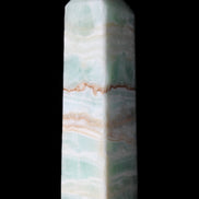 Pistachio Calcite obelisk 134mm 346g in sunlight - Rocks and Things Store