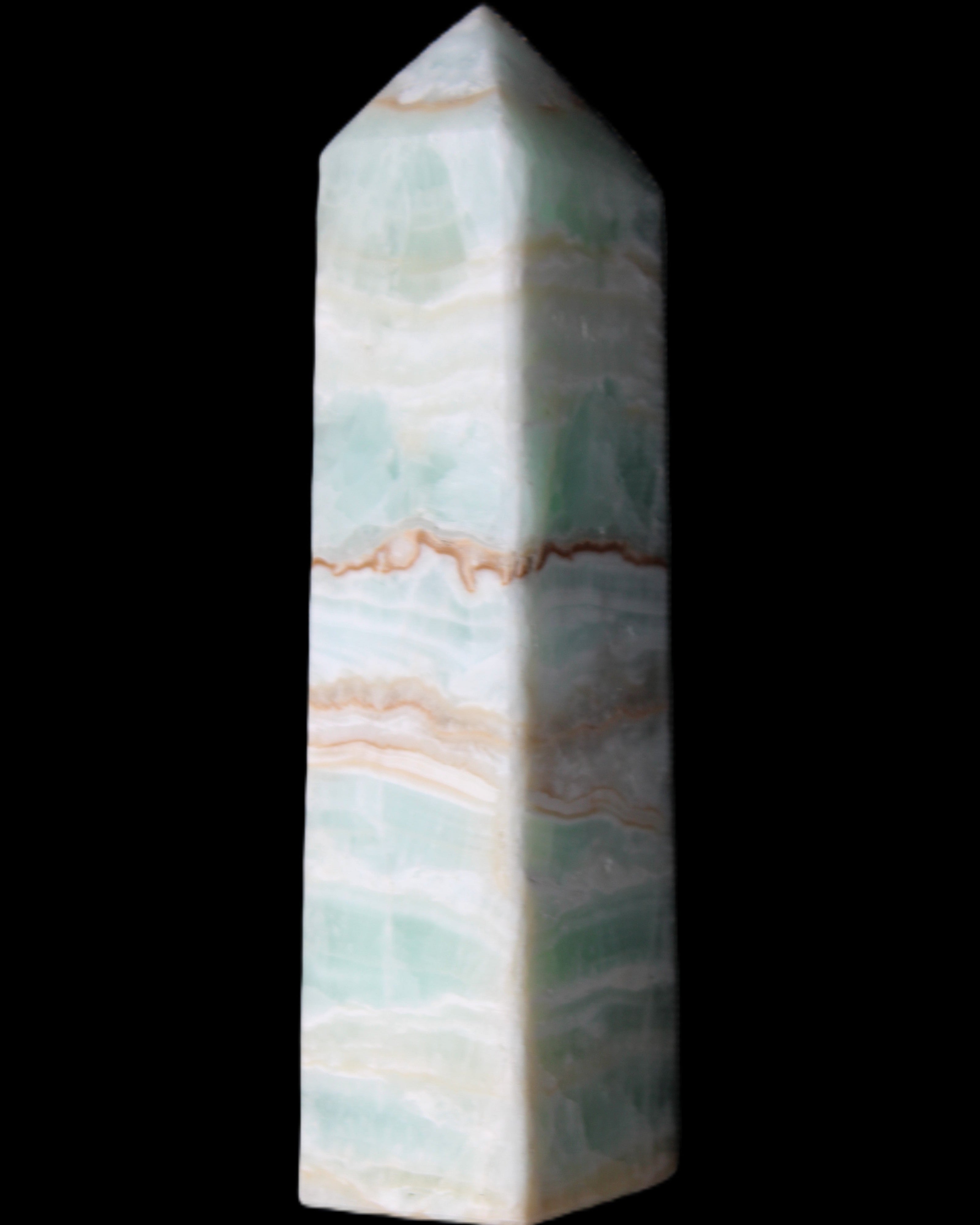 Pistachio Calcite obelisk 134mm 346g in sunlight - Rocks and Things Store