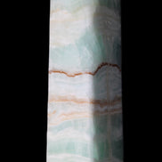 Pistachio Calcite obelisk 134mm 346g in sunlight - Rocks and Things Store