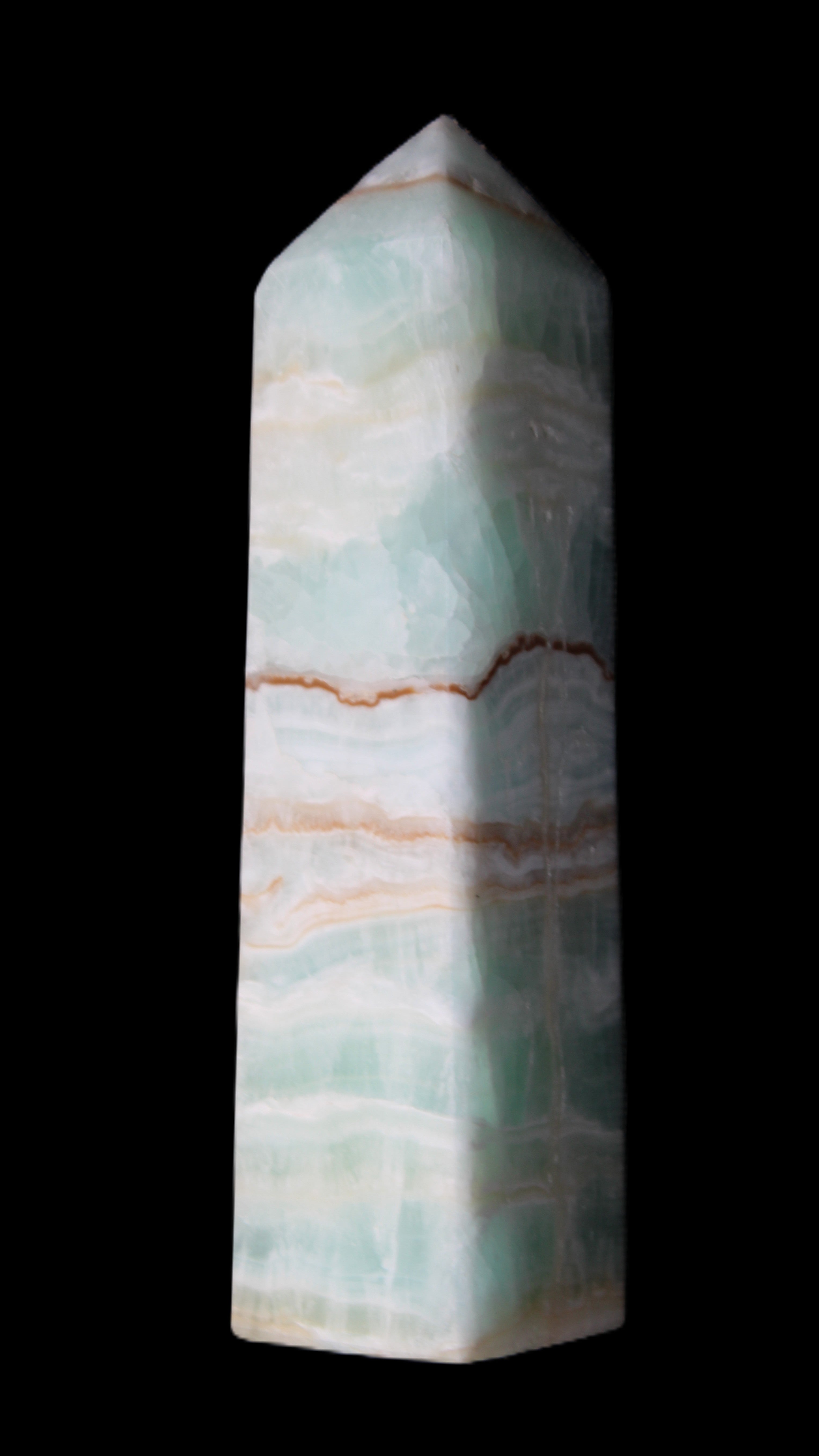 Pistachio Calcite obelisk 134mm 346g in sunlight - Rocks and Things Store