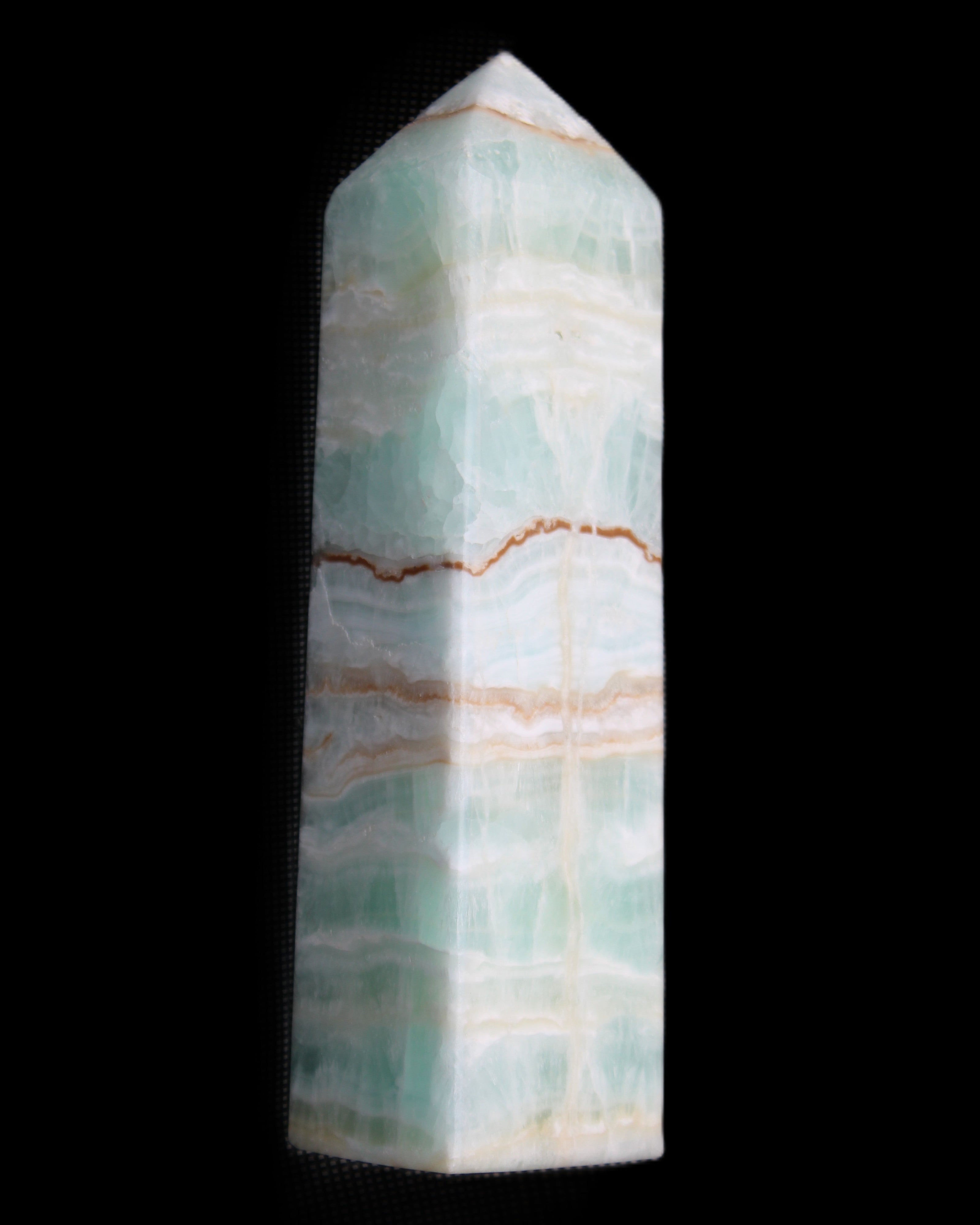 Pistachio Calcite obelisk 134mm 346g in sunlight - Rocks and Things Store