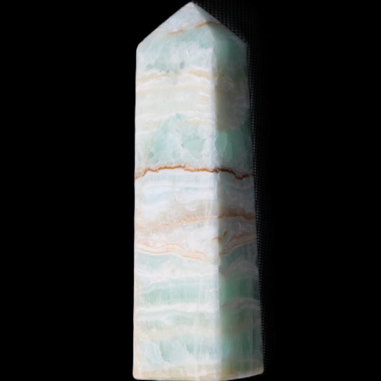 Pistachio Calcite obelisk 134mm 346g in sunlight - Rocks and Things Store