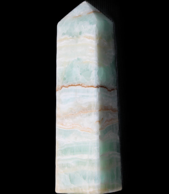 Pistachio Calcite obelisk 134mm 346g in sunlight - Rocks and Things Store
