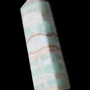 Pistachio Calcite obelisk 134mm 346g in sunlight - Rocks and Things Store