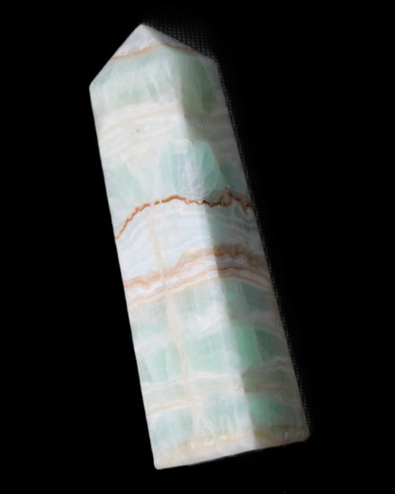 Pistachio Calcite obelisk 134mm 346g in sunlight - Rocks and Things Store