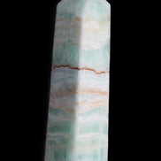 Pistachio Calcite obelisk 134mm 346g in sunlight - Rocks and Things Store