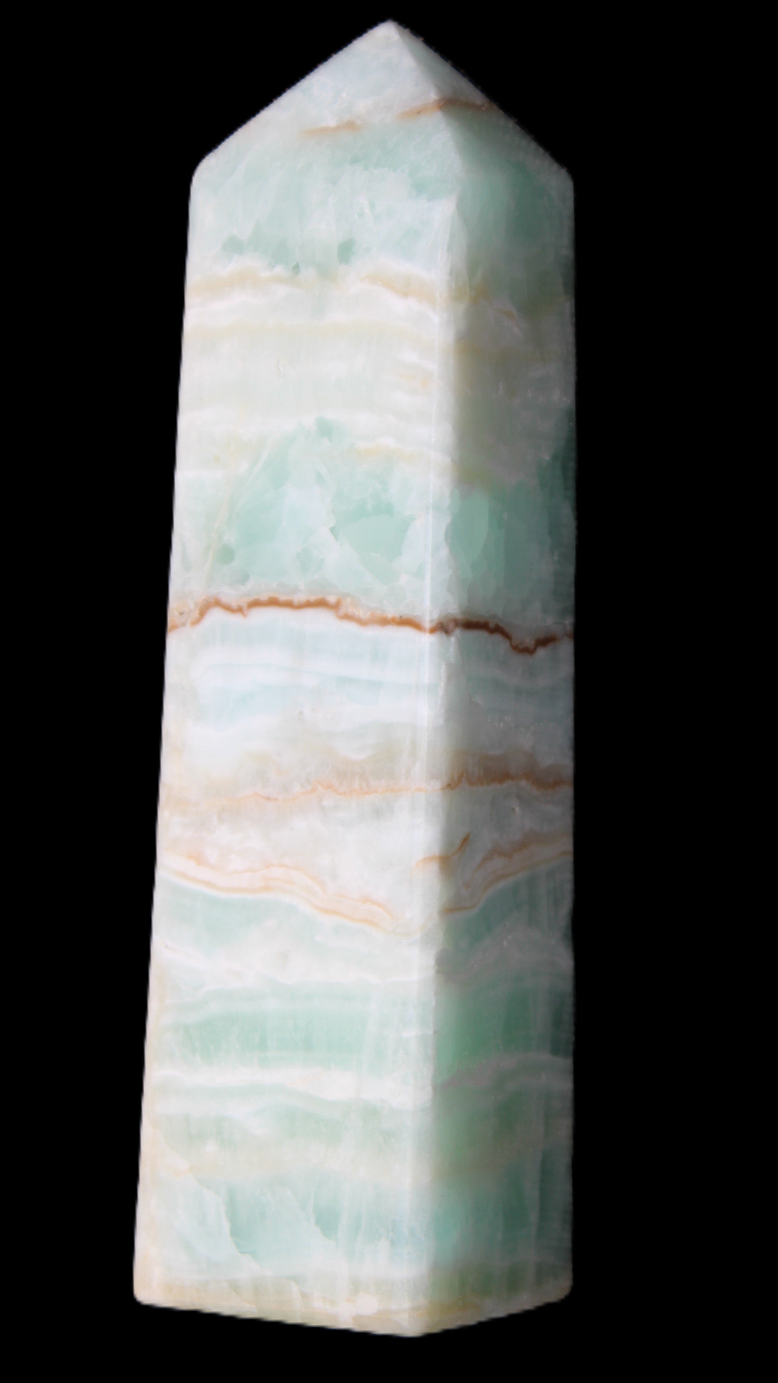 Pistachio Calcite obelisk 134mm 346g in sunlight - Rocks and Things Store