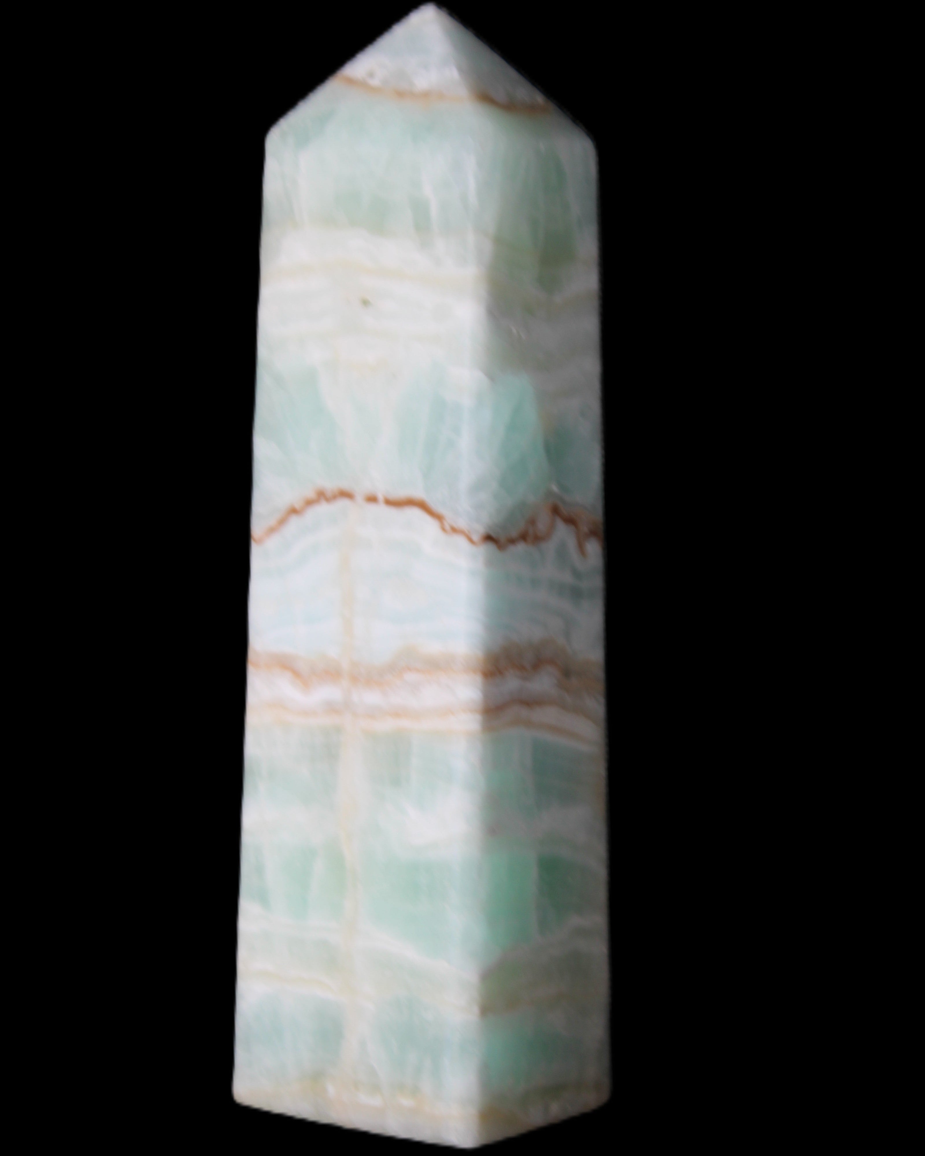Pistachio Calcite obelisk 134mm 346g in sunlight - Rocks and Things Store