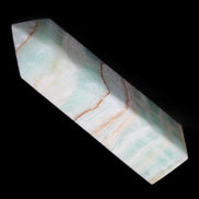 Pistachio Calcite obelisk 134mm 346g in sunlight - Rocks and Things Store