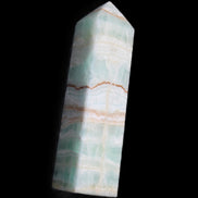 Pistachio Calcite obelisk 134mm 346g in sunlight - Rocks and Things Store