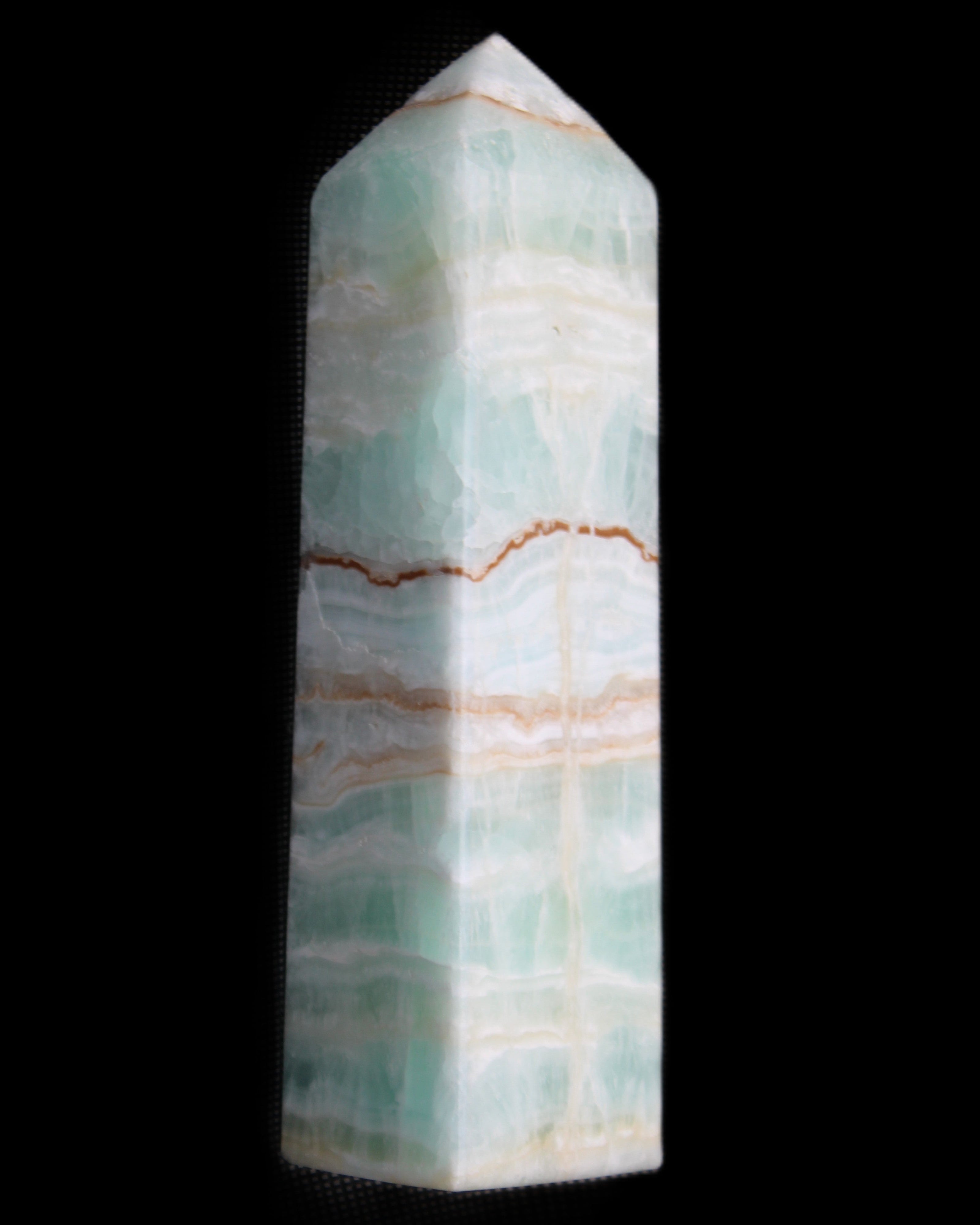 Pistachio Calcite obelisk 134mm 346g in sunlight - Rocks and Things Store