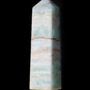 Pistachio Calcite obelisk 134mm 346g in sunlight - Rocks and Things Store