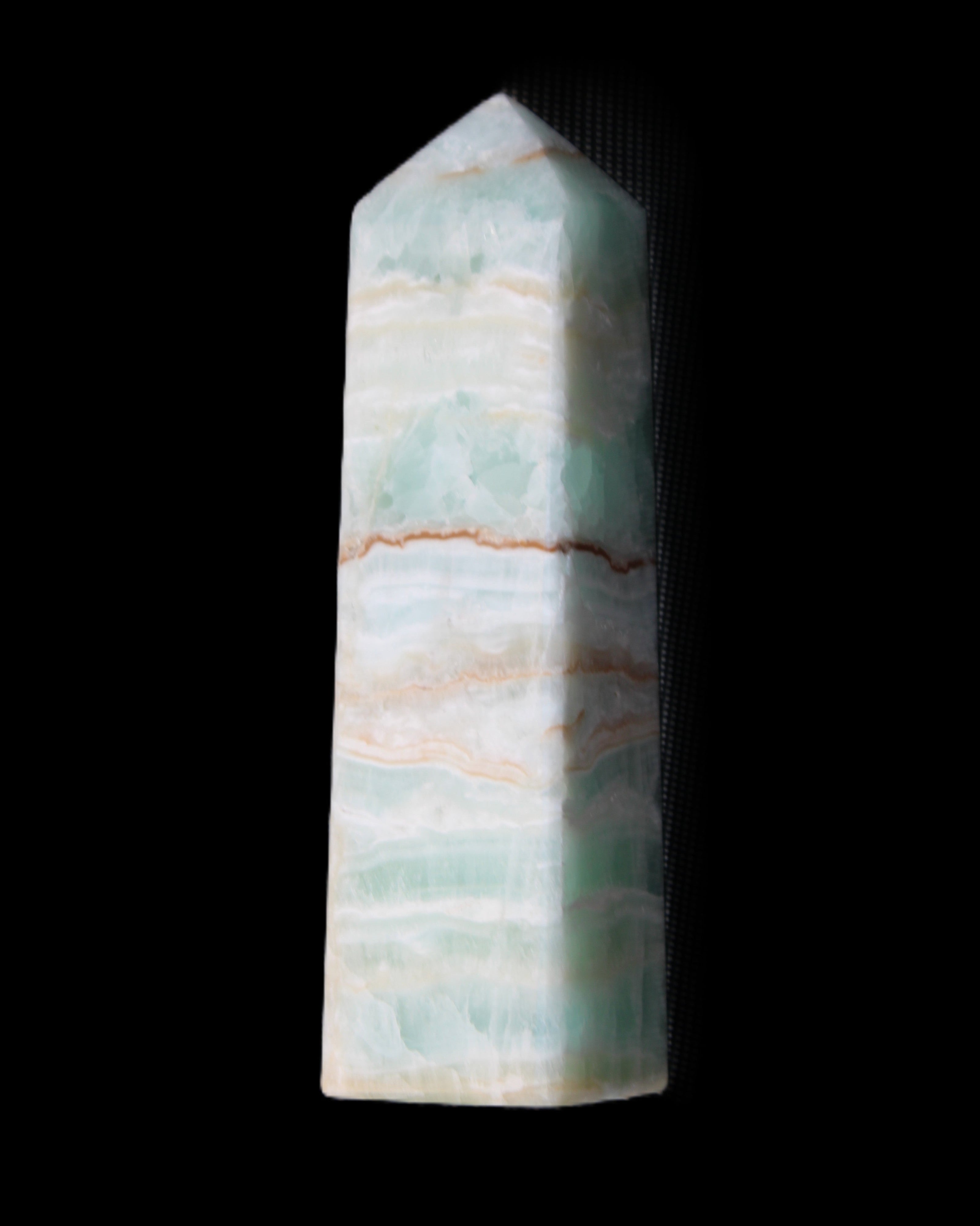 Pistachio Calcite obelisk 134mm 346g in sunlight - Rocks and Things Store