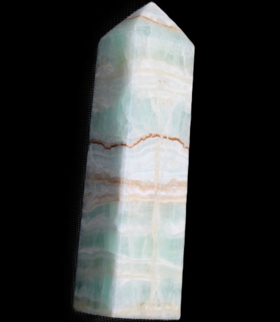 Pistachio Calcite obelisk 134mm 346g in sunlight - Rocks and Things Store