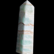 Pistachio Calcite obelisk 134mm 346g in sunlight - Rocks and Things Store