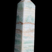 Pistachio Calcite obelisk 134mm 346g in sunlight - Rocks and Things Store