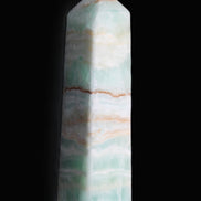 Pistachio Calcite obelisk 134mm 346g in sunlight - Rocks and Things Store