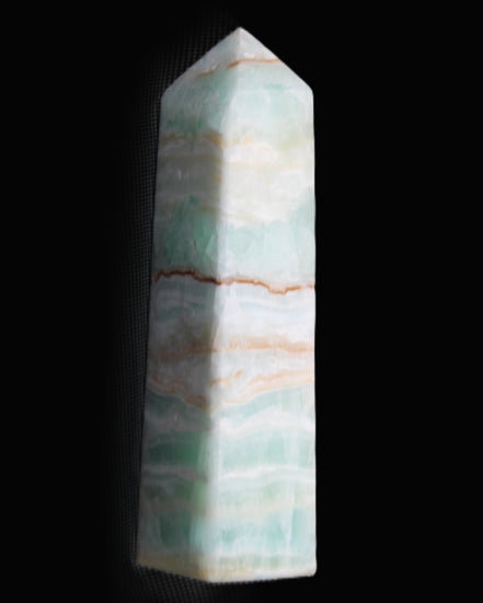 Pistachio Calcite obelisk 134mm 346g in sunlight - Rocks and Things Store