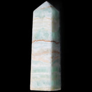 Pistachio Calcite obelisk 134mm 346g in sunlight - Rocks and Things Store