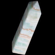 Pistachio Calcite obelisk 134mm 346g in sunlight - Rocks and Things Store