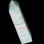 Pistachio Calcite obelisk 134mm 346g in sunlight - Rocks and Things Store