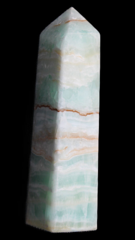 Pistachio Calcite obelisk 134mm 346g in sunlight - Rocks and Things Store
