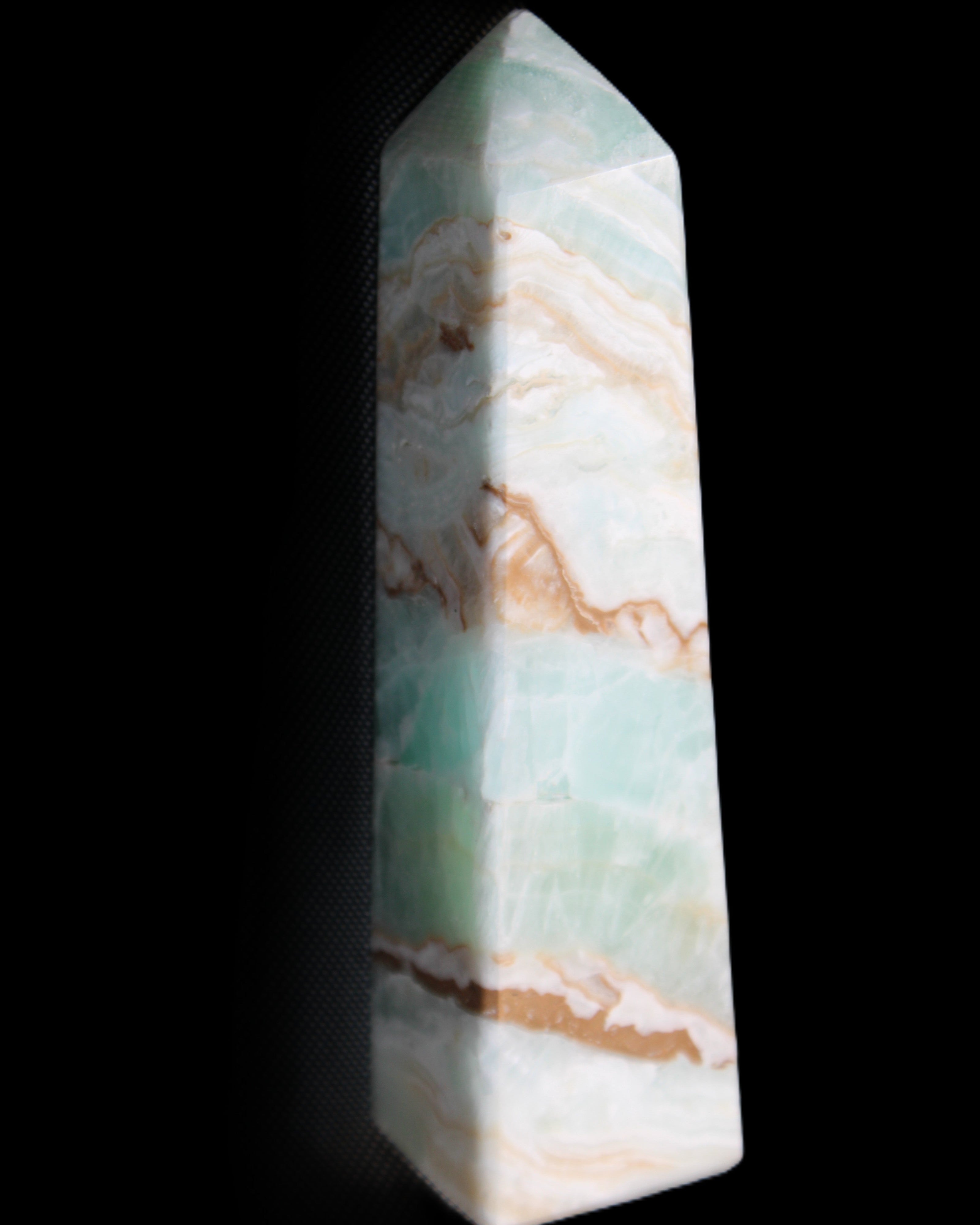 Pistachio Calcite obelisk 147mm 419g in sunlight - Rocks and Things Store