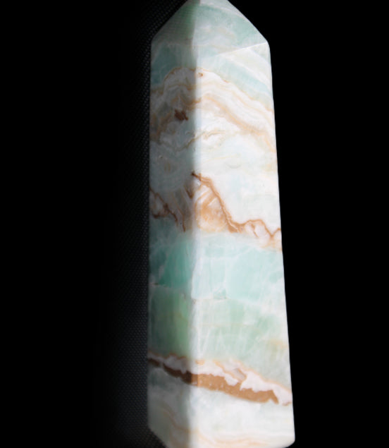Pistachio Calcite obelisk 147mm 419g in sunlight - Rocks and Things Store
