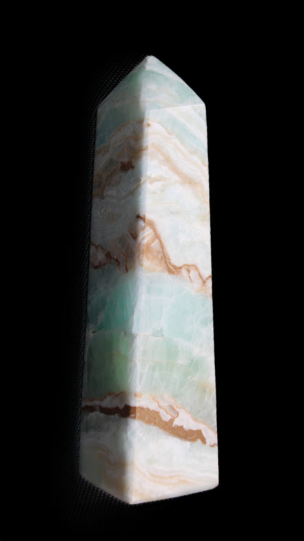 Pistachio Calcite obelisk 147mm 419g in sunlight - Rocks and Things Store