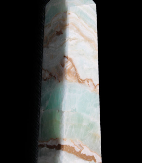 Pistachio Calcite obelisk 147mm 419g in sunlight - Rocks and Things Store
