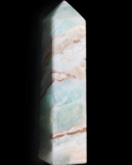 Pistachio Calcite obelisk 147mm 419g in sunlight - Rocks and Things Store