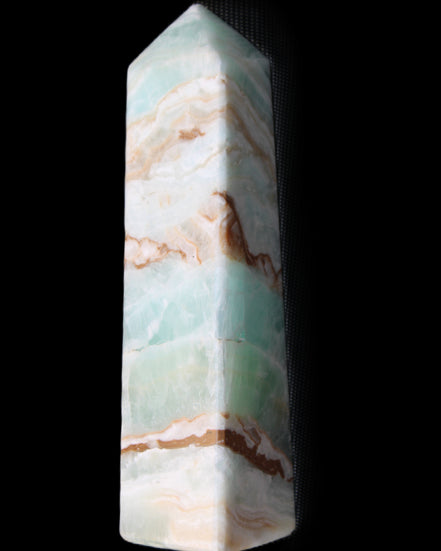Pistachio Calcite obelisk 147mm 419g in sunlight - Rocks and Things Store