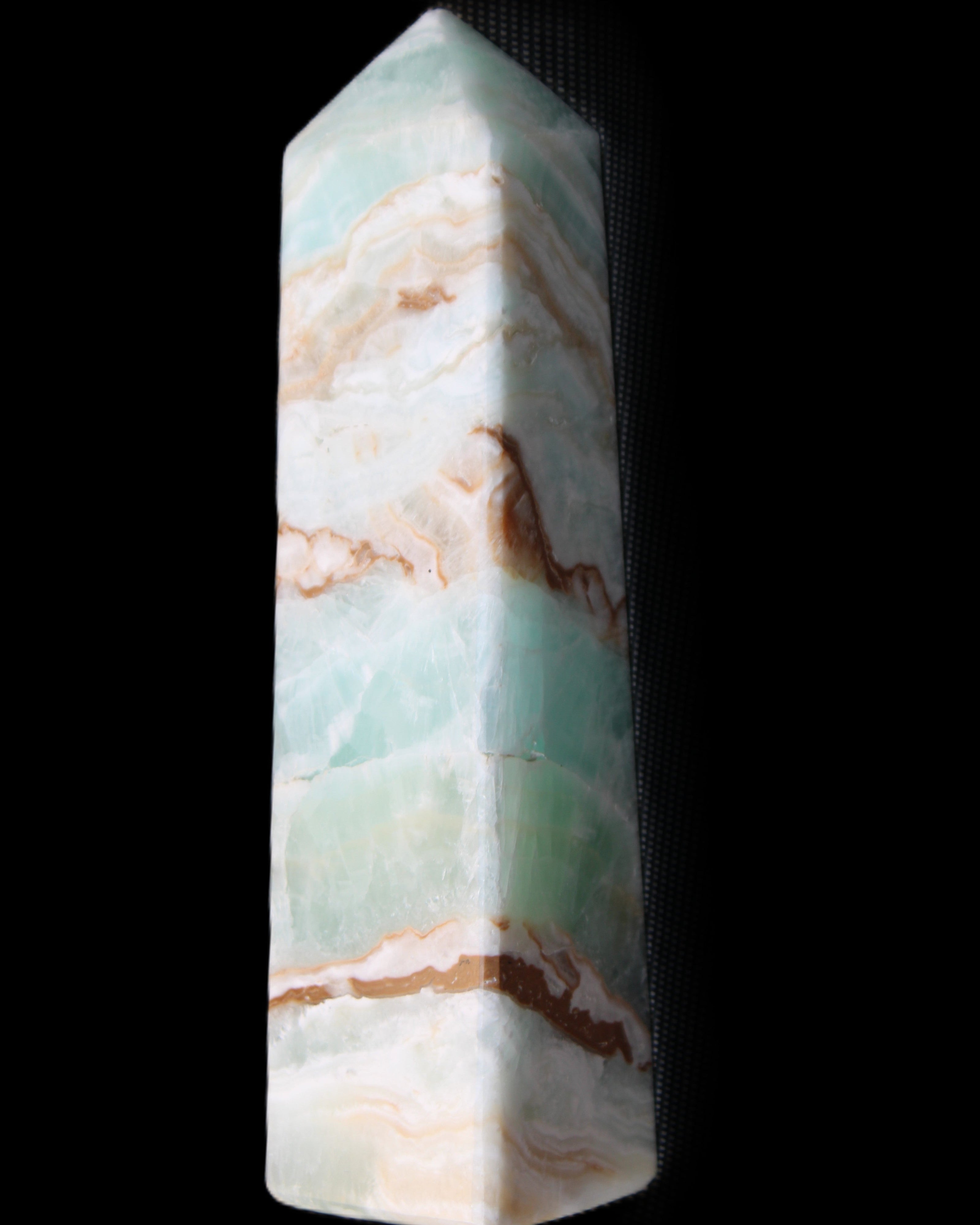 Pistachio Calcite obelisk 147mm 419g in sunlight - Rocks and Things Store