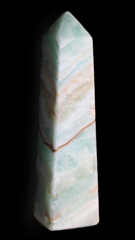 Pistachio Calcite obelisk 147mm 419g in sunlight - Rocks and Things Store
