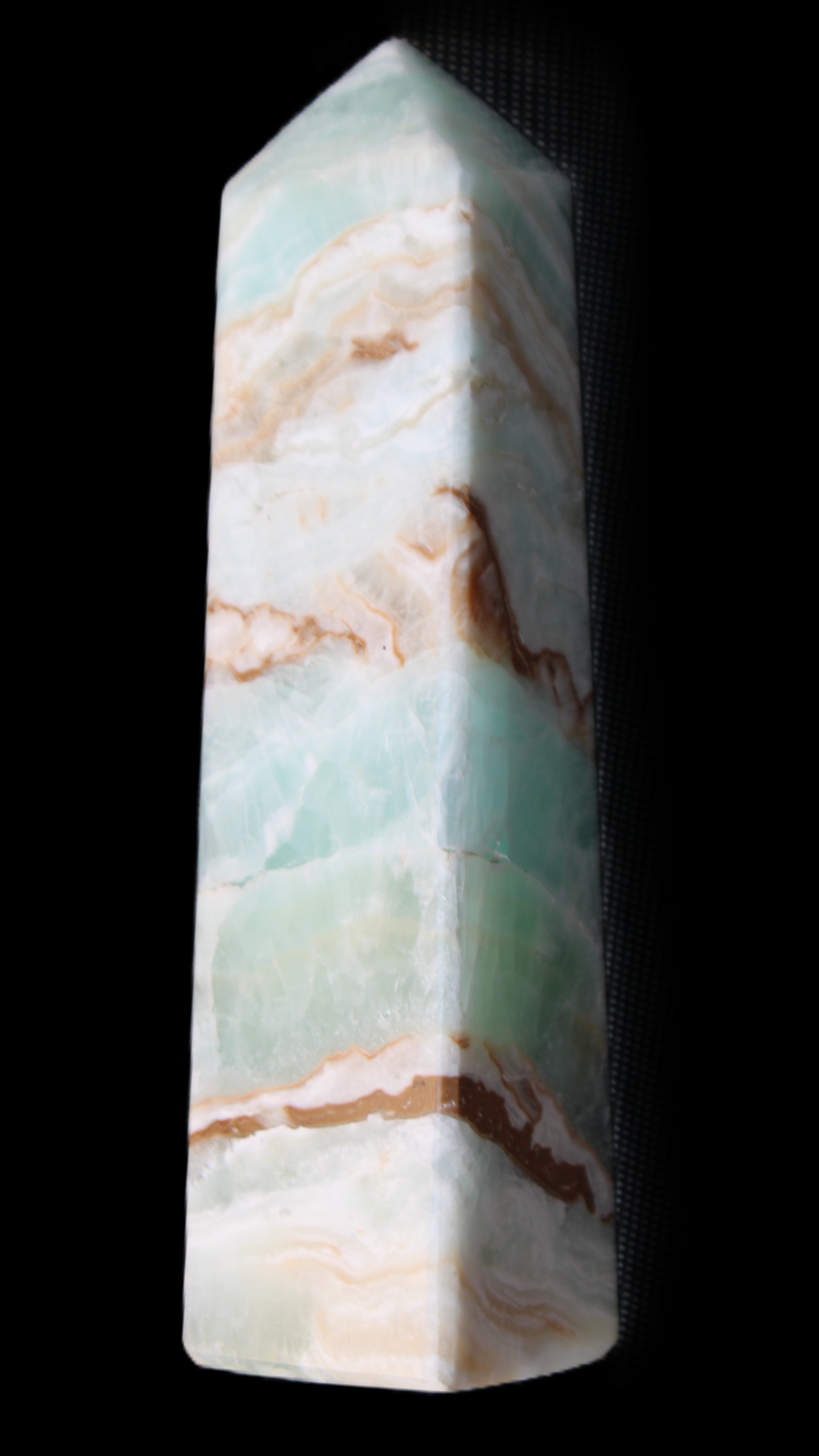 Pistachio Calcite obelisk 147mm 419g in sunlight - Rocks and Things Store