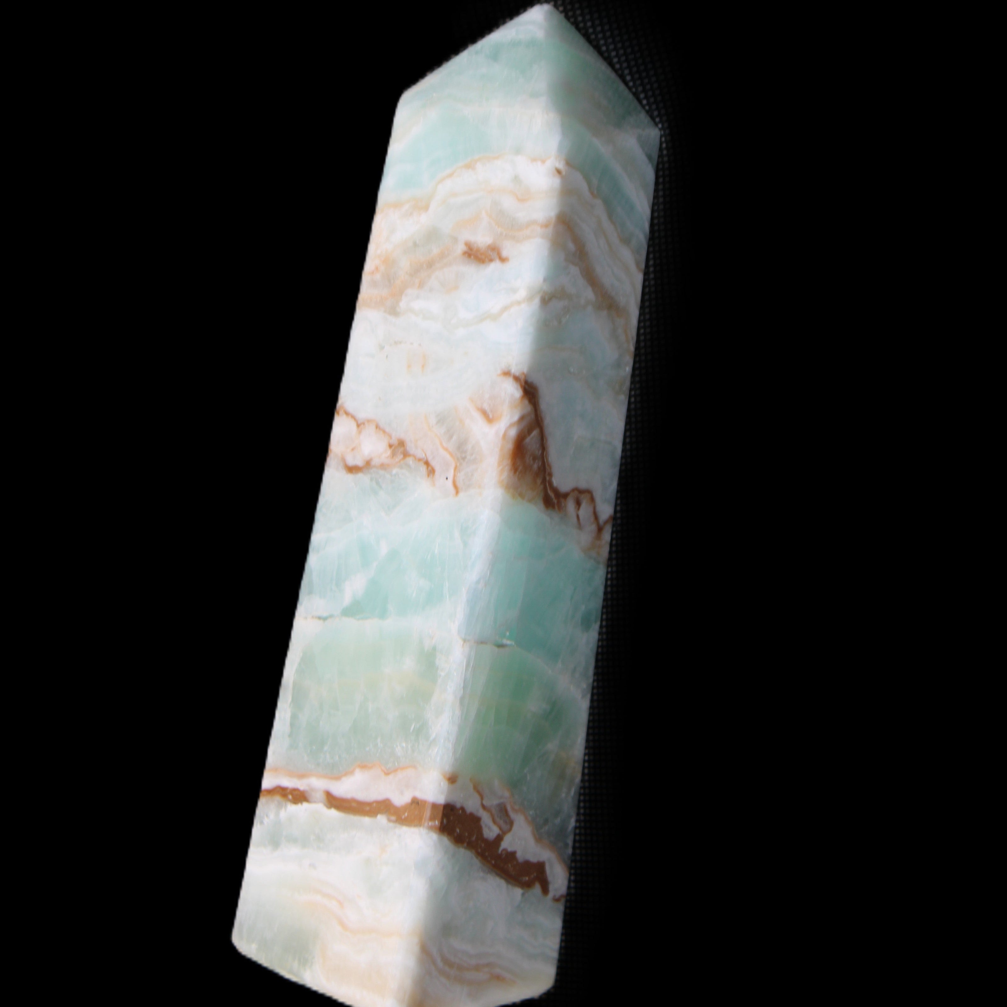 Pistachio Calcite obelisk 147mm 419g in sunlight - Rocks and Things Store