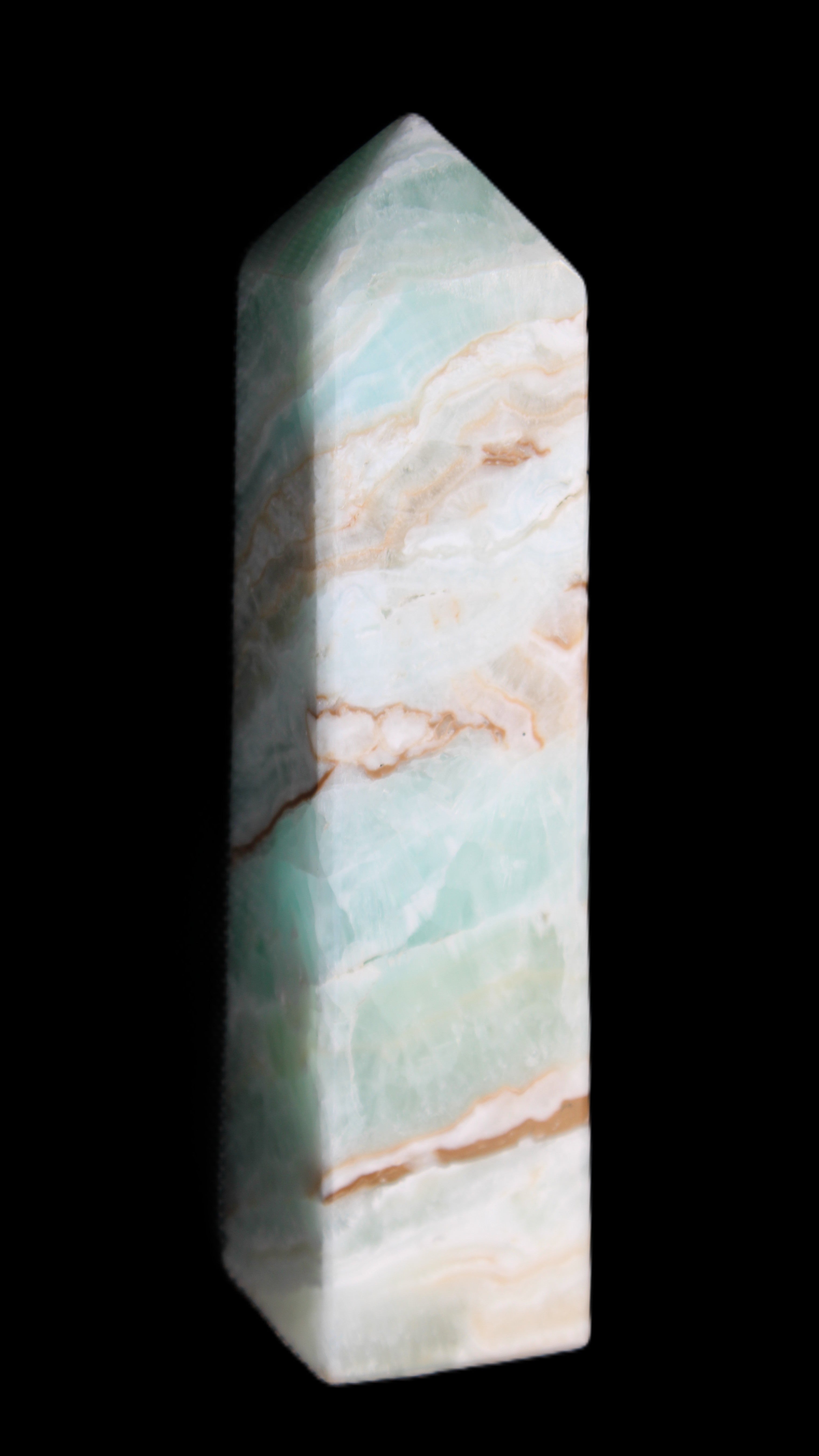 Pistachio Calcite obelisk 147mm 419g in sunlight - Rocks and Things Store