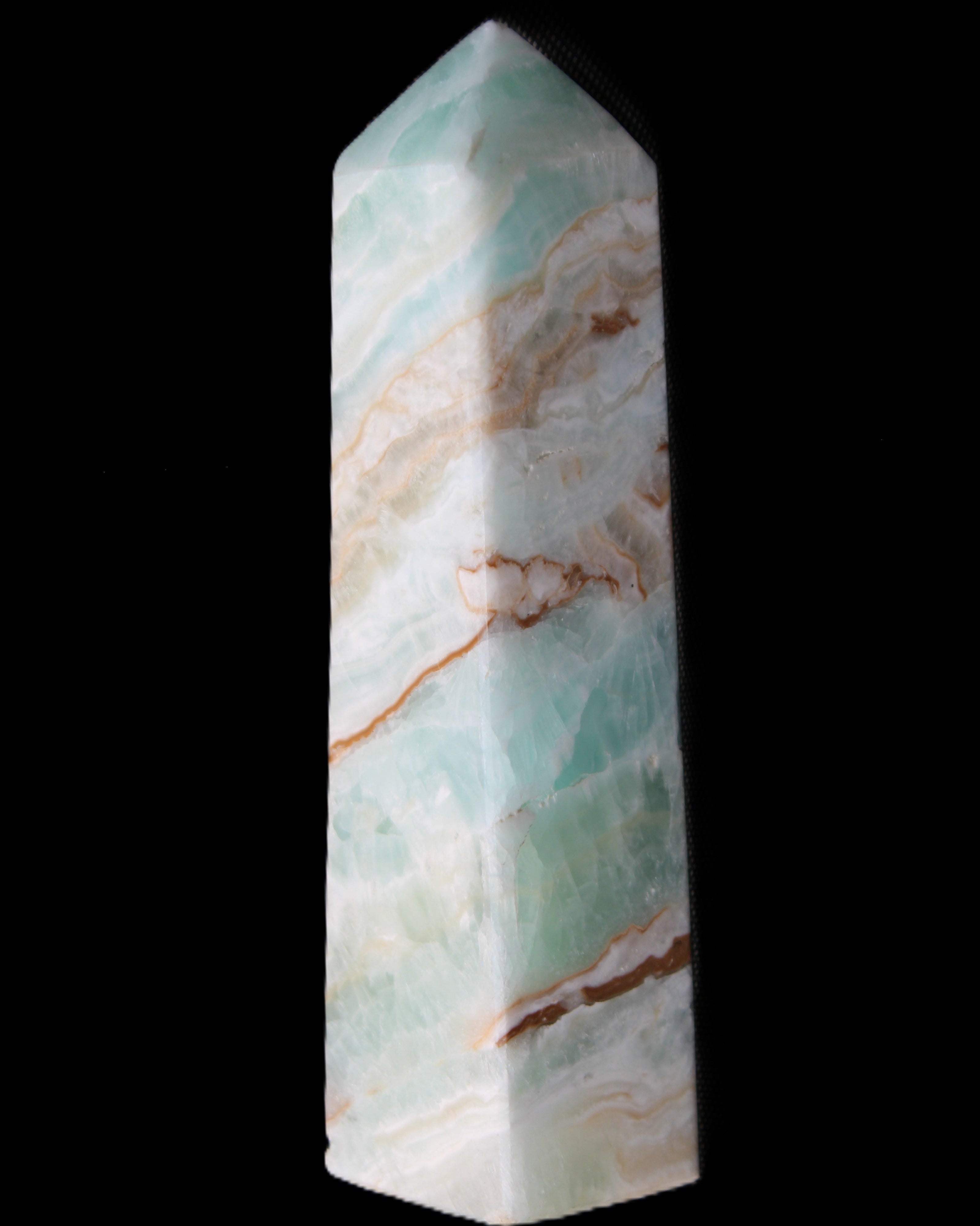 Pistachio Calcite obelisk 147mm 419g in sunlight - Rocks and Things Store