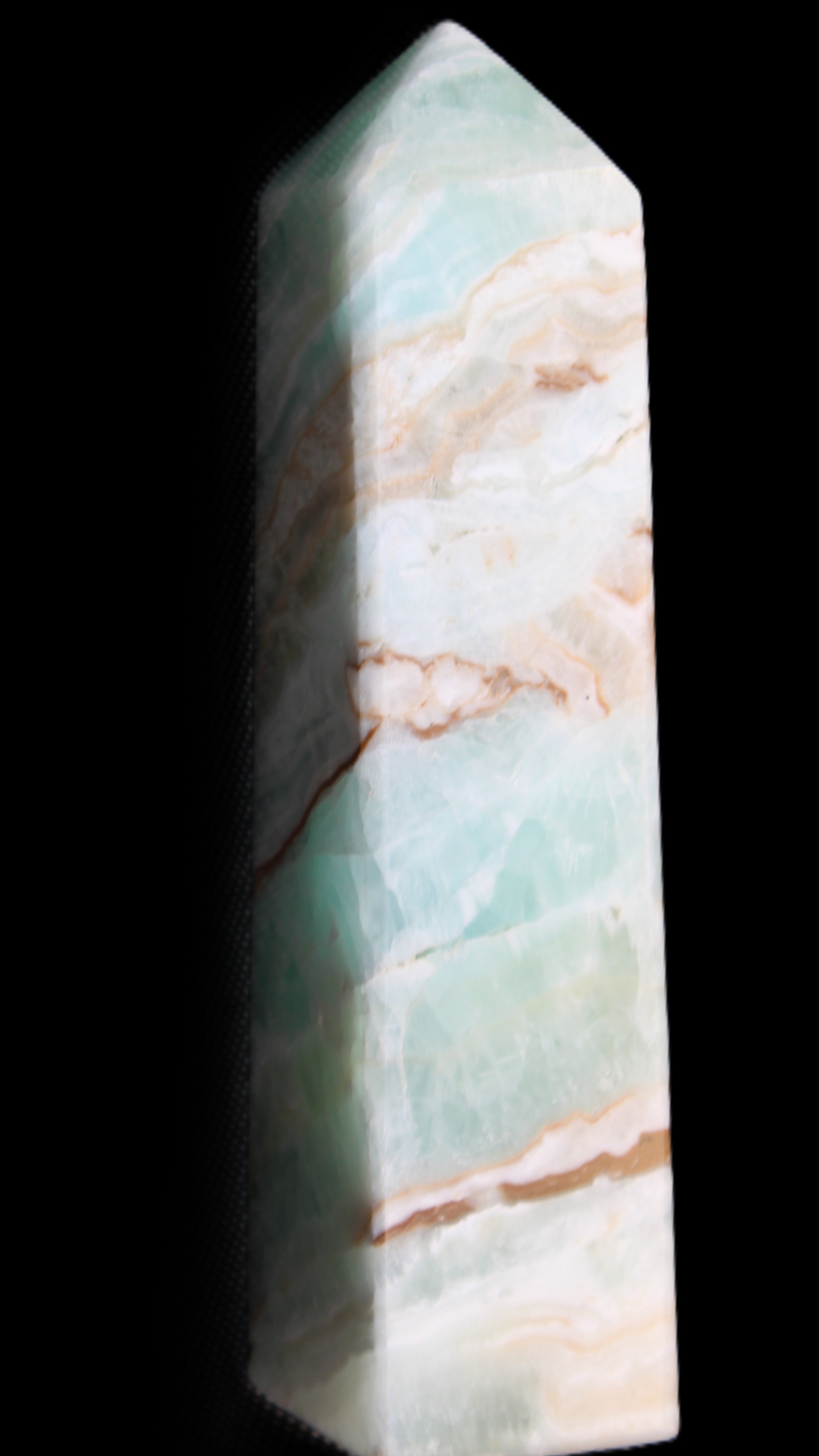 Pistachio Calcite obelisk 147mm 419g in sunlight - Rocks and Things Store