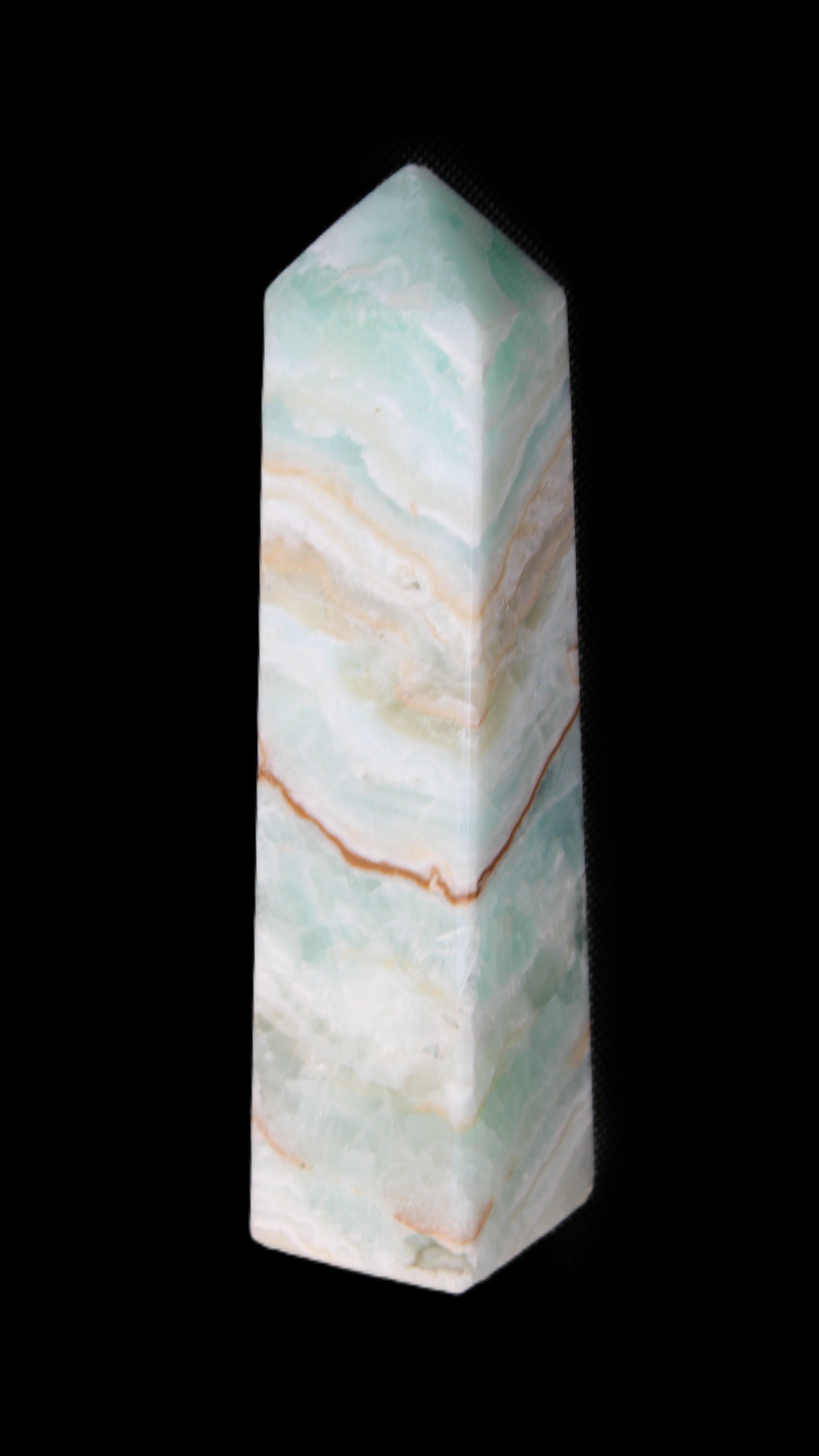 Pistachio Calcite obelisk 147mm 419g in sunlight - Rocks and Things Store