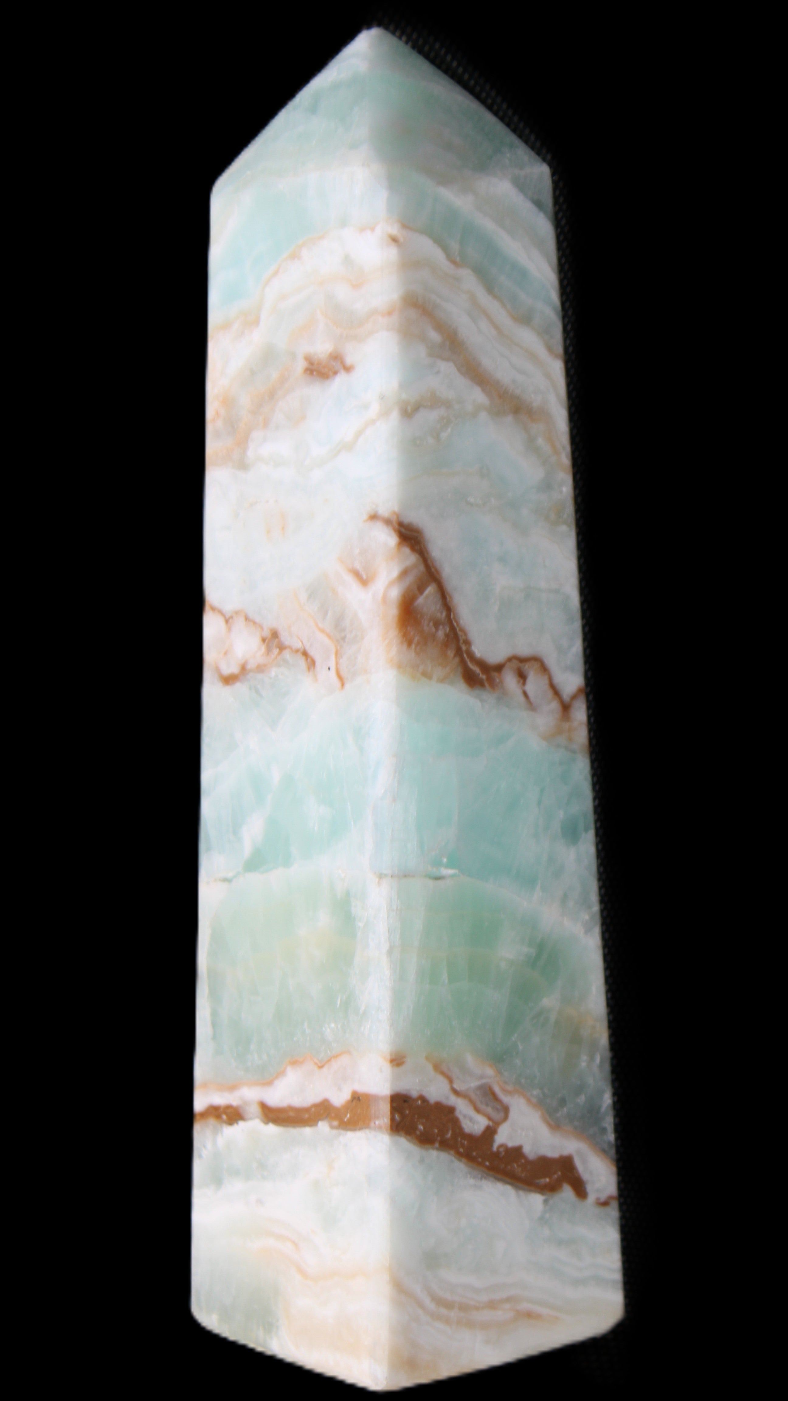 Pistachio Calcite obelisk 147mm 419g in sunlight - Rocks and Things Store