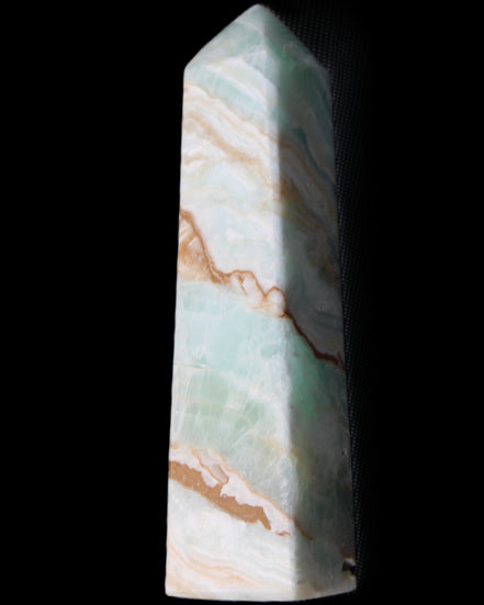 Pistachio Calcite obelisk 147mm 419g in sunlight - Rocks and Things Store