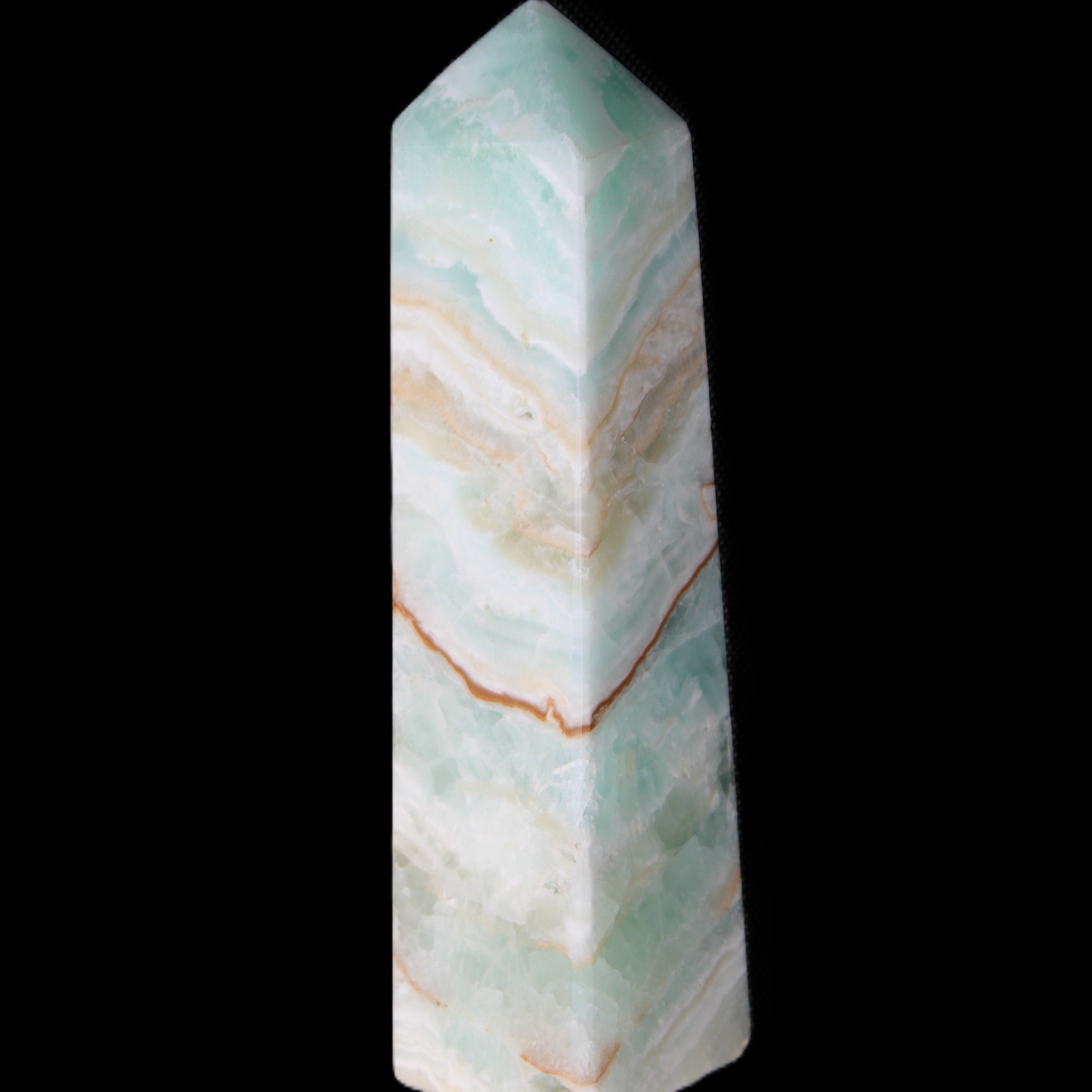 Pistachio Calcite obelisk 147mm 419g in sunlight - Rocks and Things Store