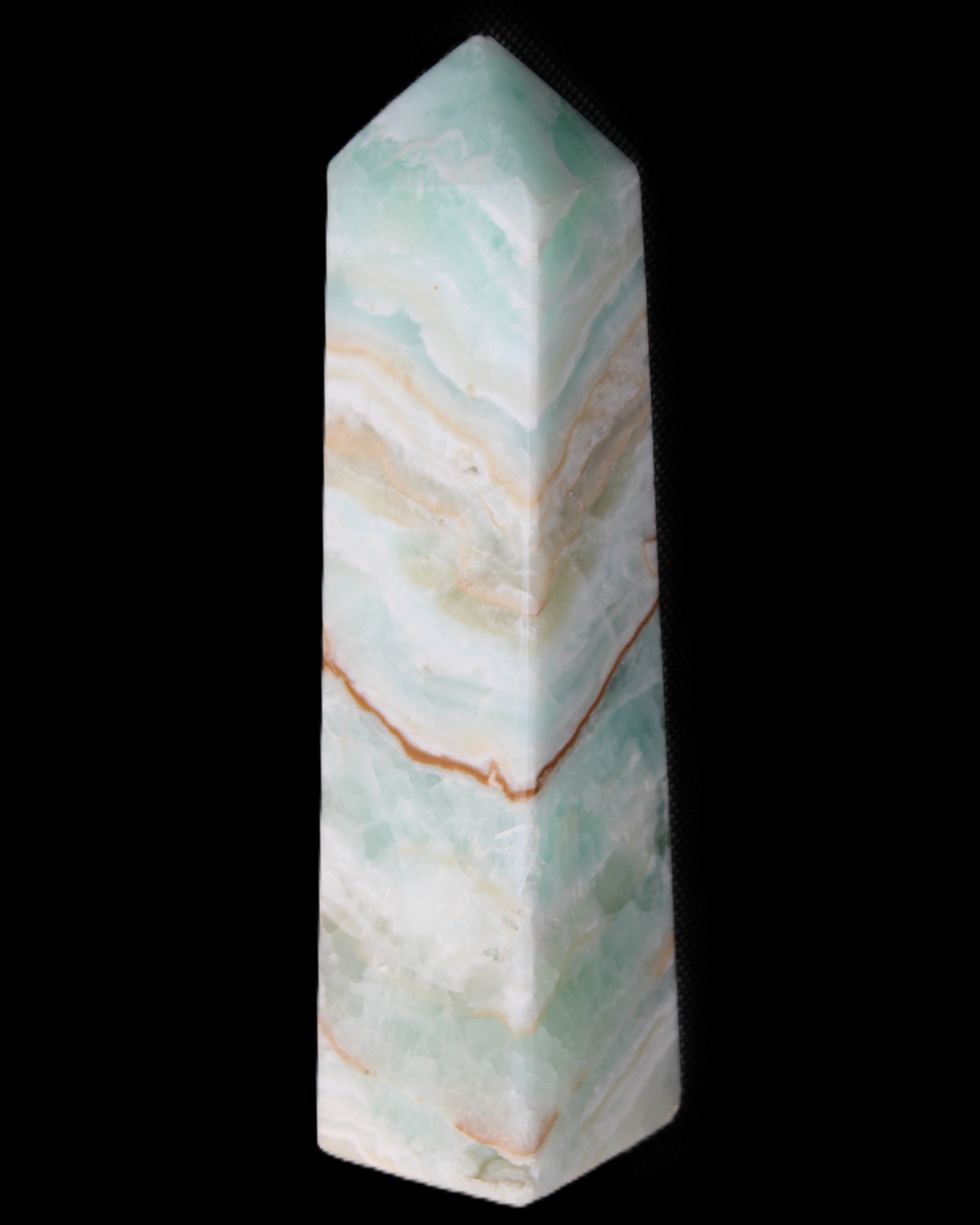 Pistachio Calcite obelisk 147mm 419g in sunlight - Rocks and Things Store