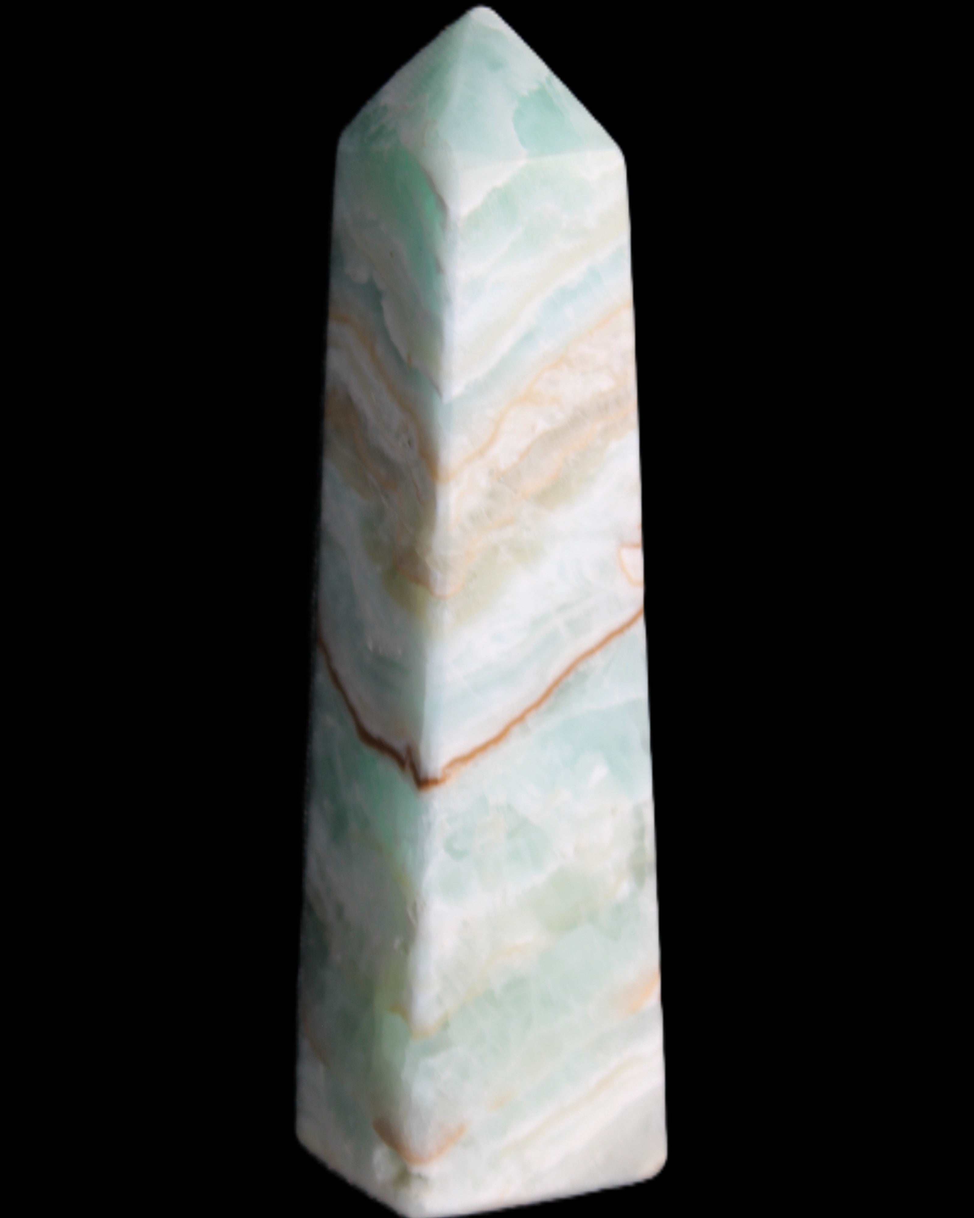 Pistachio Calcite obelisk 147mm 419g in sunlight - Rocks and Things Store