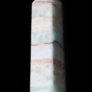 Pistachio Calcite obelisk 134mm 339g in sunlight - Rocks and Things Store