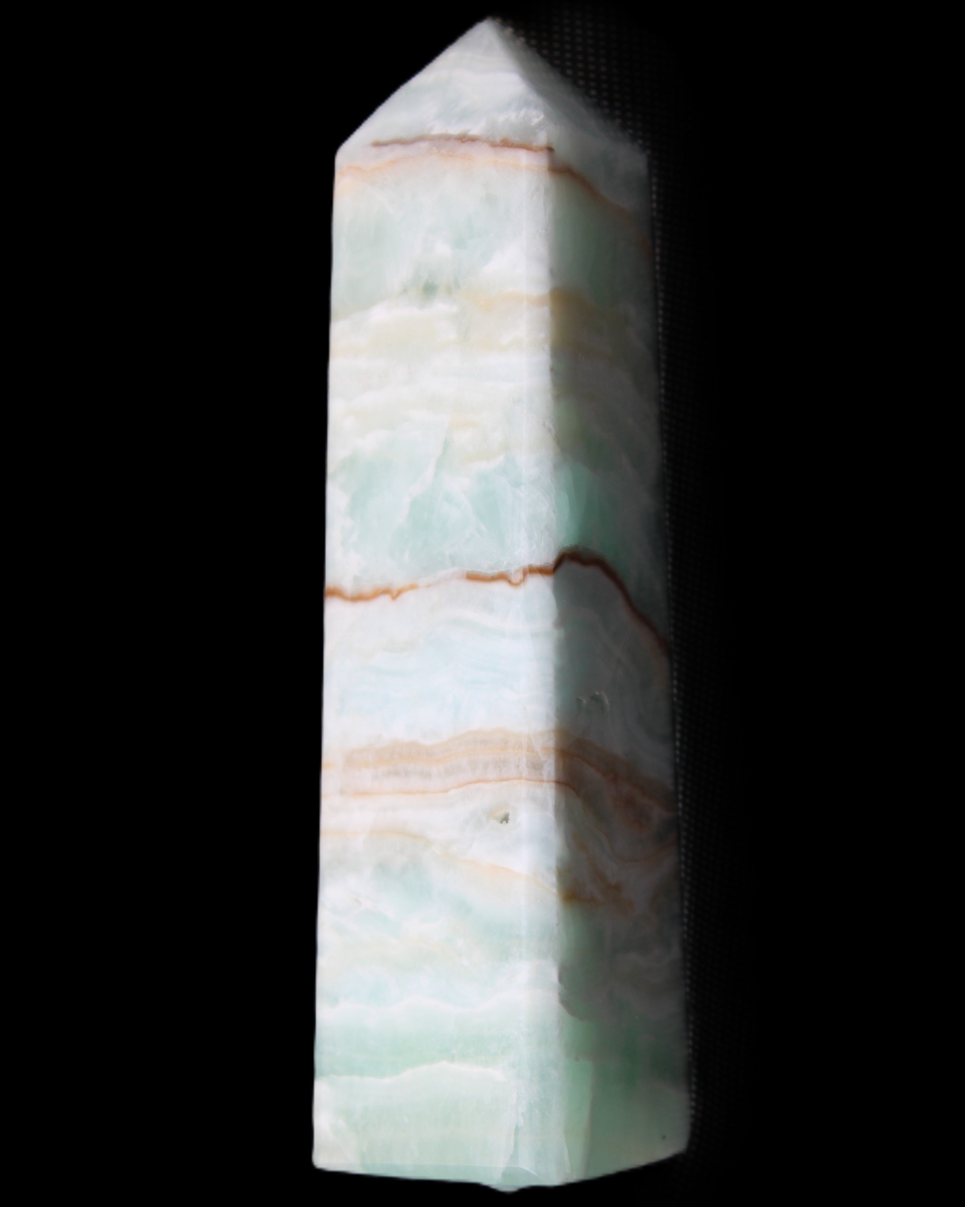 Pistachio Calcite obelisk 134mm 339g in sunlight - Rocks and Things Store