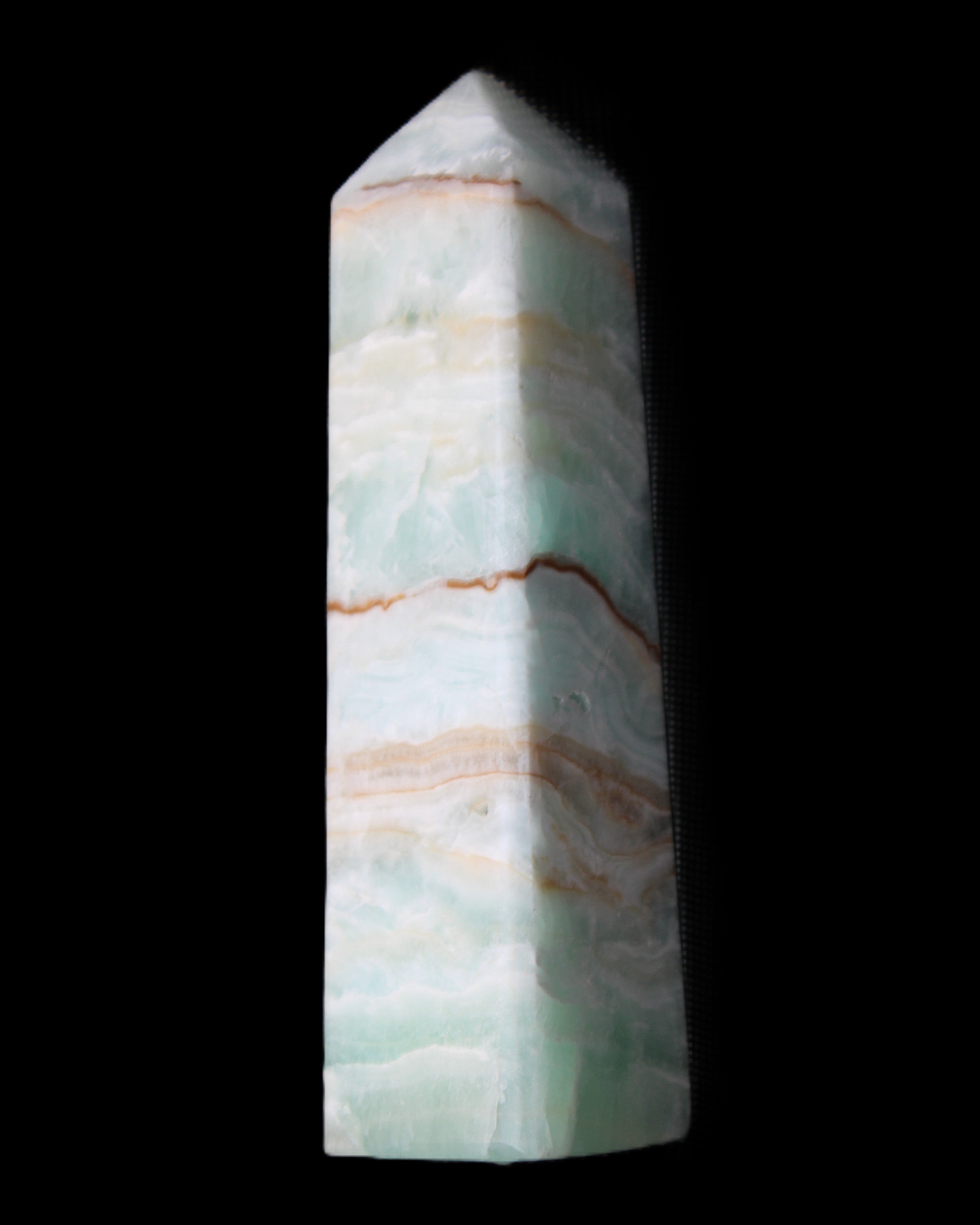 Pistachio Calcite obelisk 134mm 339g in sunlight - Rocks and Things Store