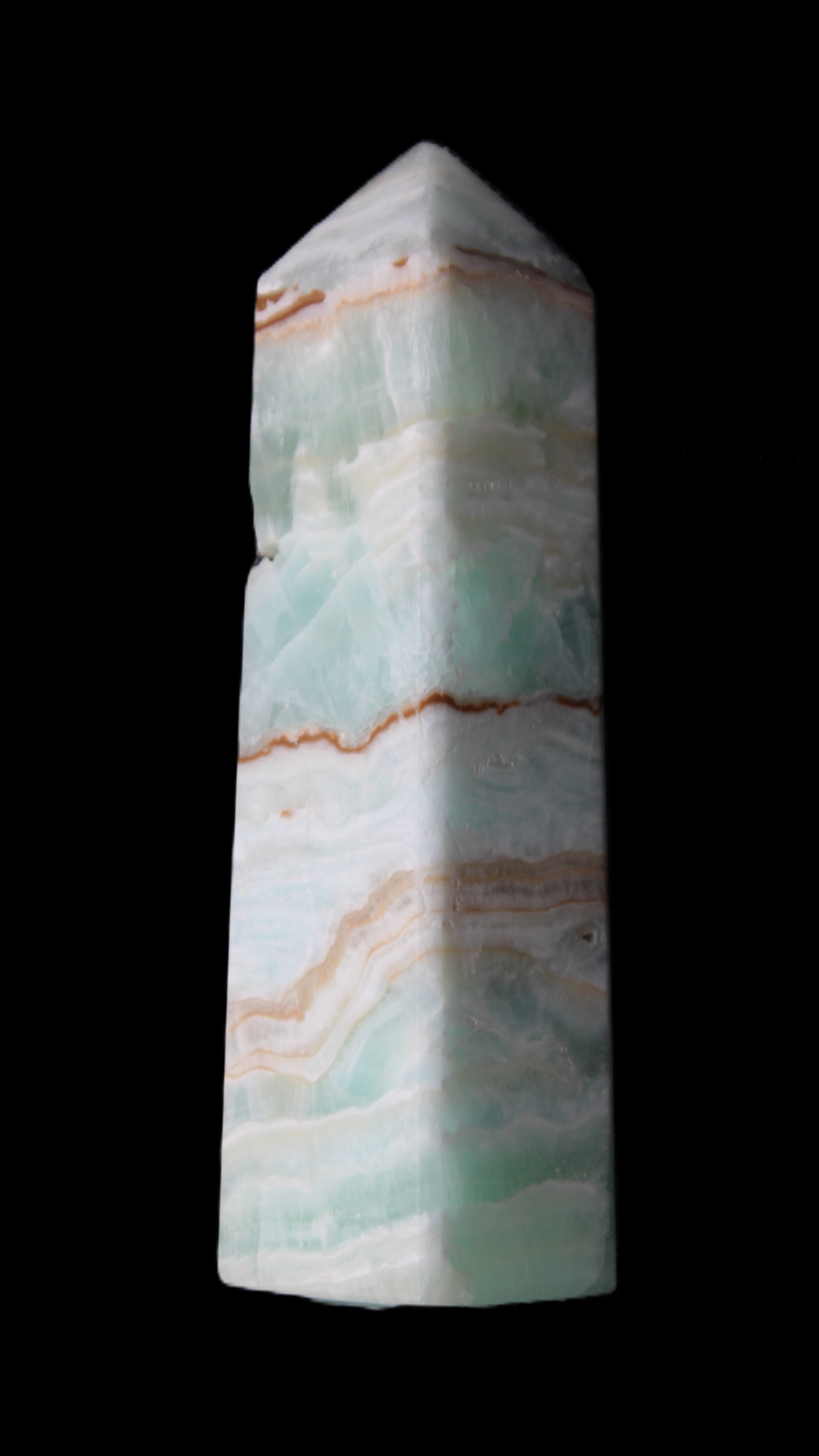 Pistachio Calcite obelisk 134mm 339g in sunlight - Rocks and Things Store