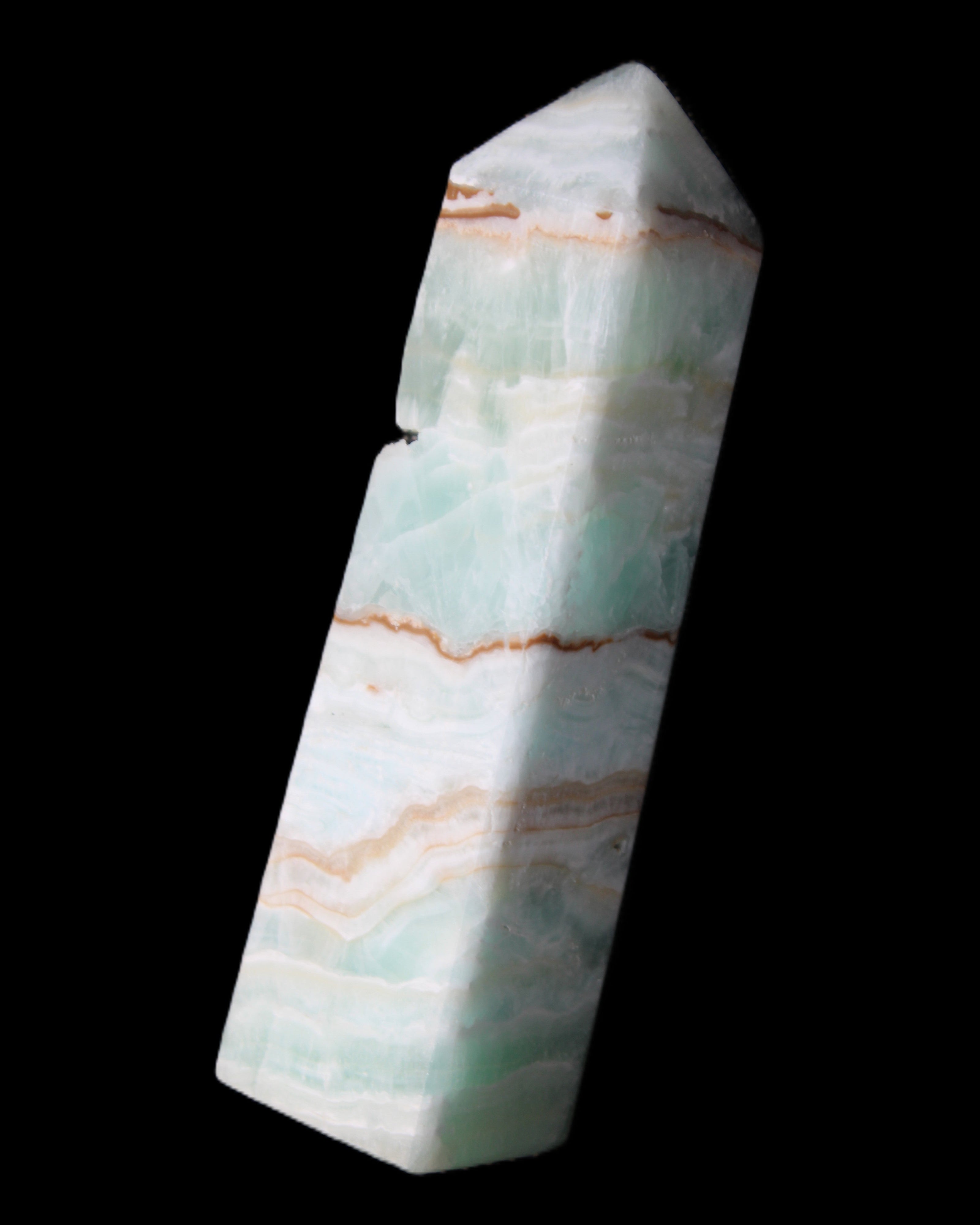 Pistachio Calcite obelisk 134mm 339g in sunlight - Rocks and Things Store